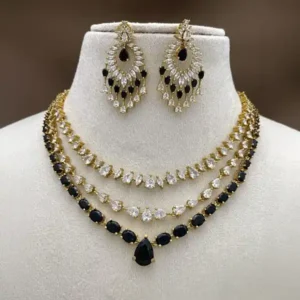 Black and white gold-tone necklace set with matching earrings