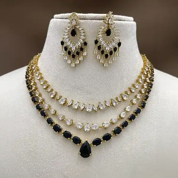 Black and white gold-tone necklace set with matching earrings